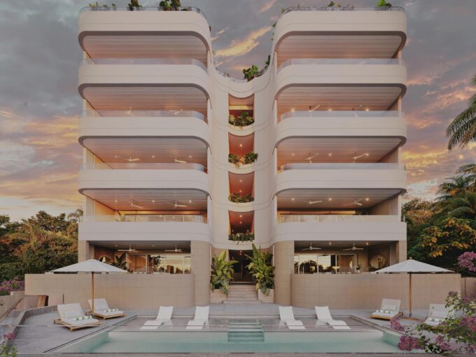 Exterior of the Gibbs Grove residences with balconies and tropical landscaping, St Peter