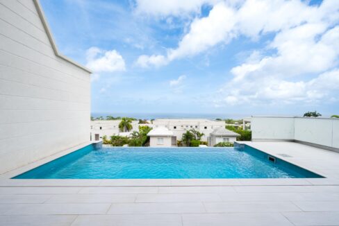 Infinity-edge pool with panoramic West Coast sea views at Westmoreland Hills 46, St James, Barbados