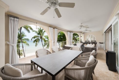 Open-plan living and dining opening to the beachfront patio with sea views at Saint Peter’s Bay 312, St Peter, Barbados