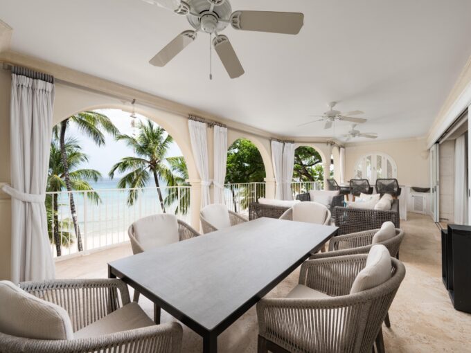 Open-plan living and dining opening to the beachfront patio with sea views at Saint Peter’s Bay 312, St Peter, Barbados