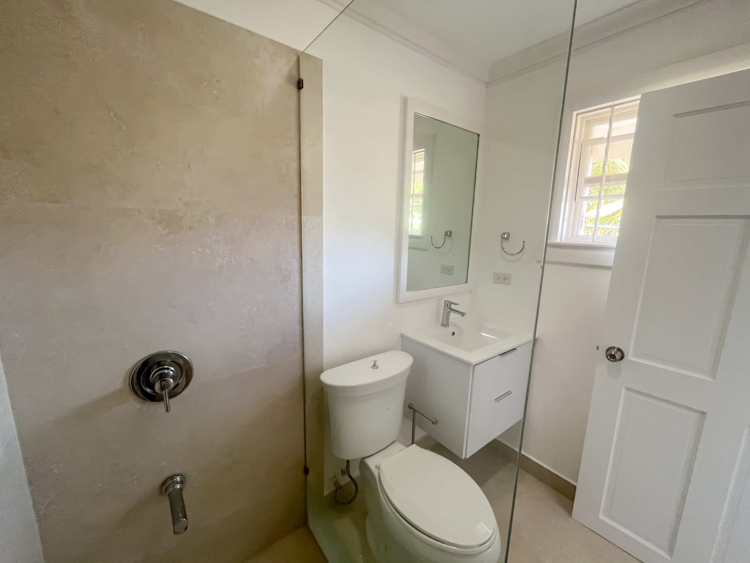 Primary en-suite bathroom with double vanity at Looking Glass, Durants, Christ Church