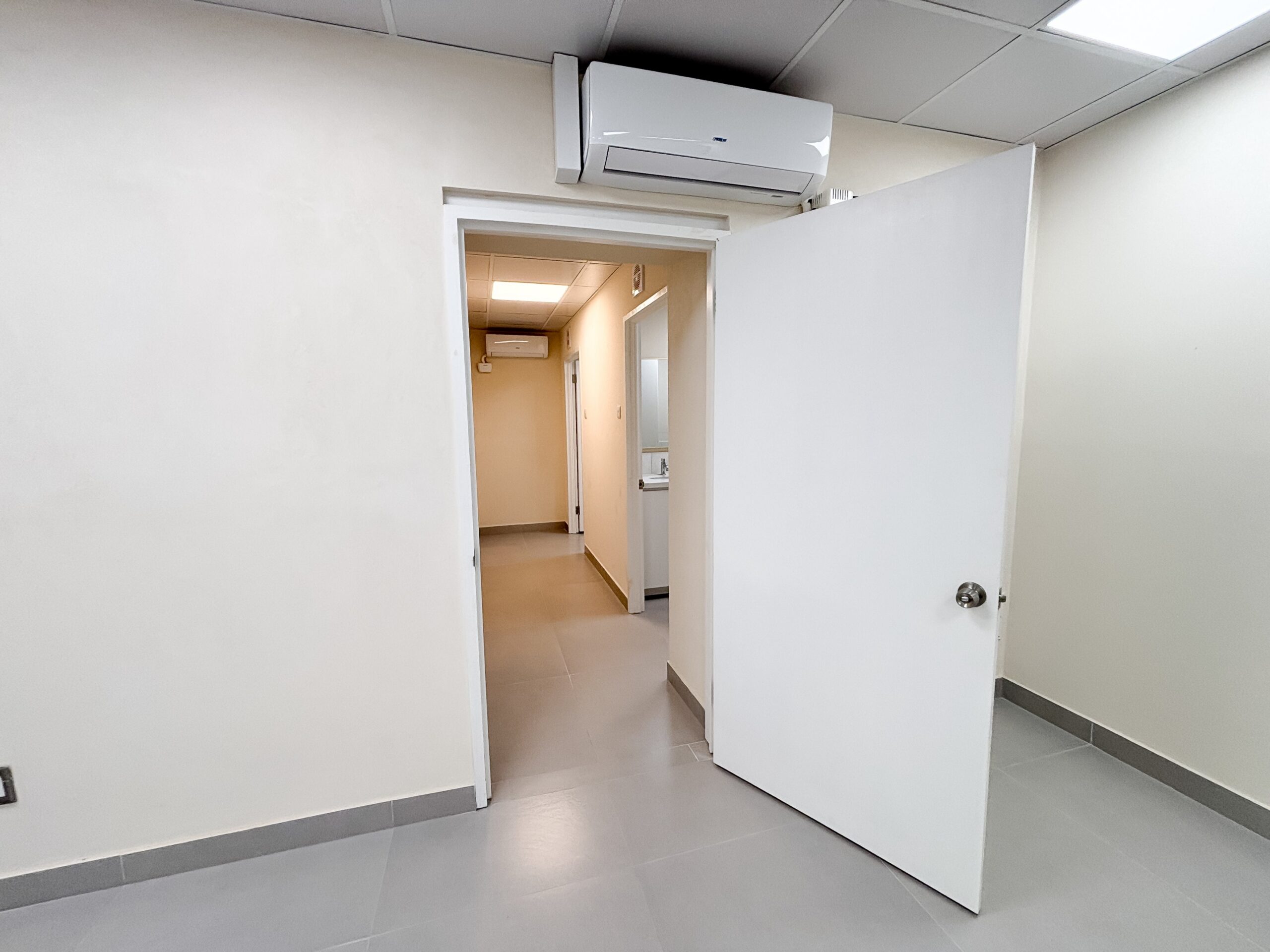 Main consultation room with entrance to the bathrooms at Pine Medical Centre Suite 2, Belleville, St Michael