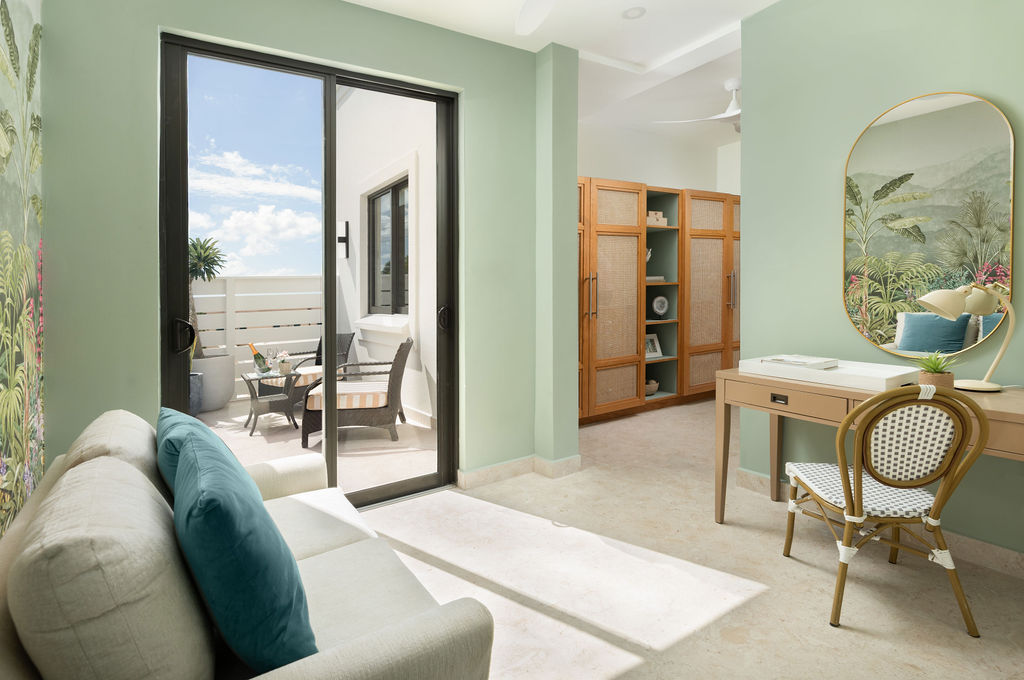 Living area opening to a sea-view terrace at Calico, a beachfront villa in St James, Barbados