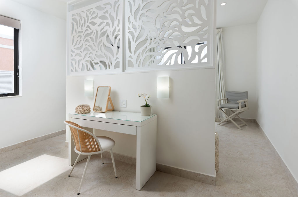 Dressing room with vanity and screen at Calico, a beachfront villa in St James, Barbados