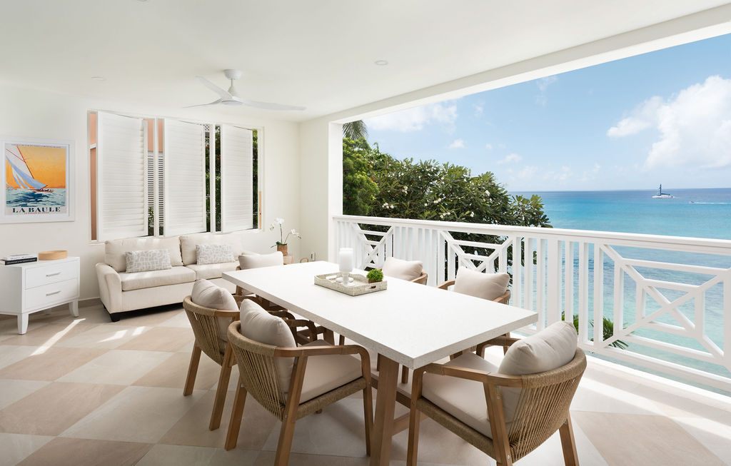 Terrace lounge and dining with sea views at Calico, a beachfront villa in St James, Barbados