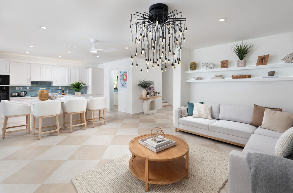 Open-plan kitchen and living area at Calico, a beachfront villa in St James, Barbados