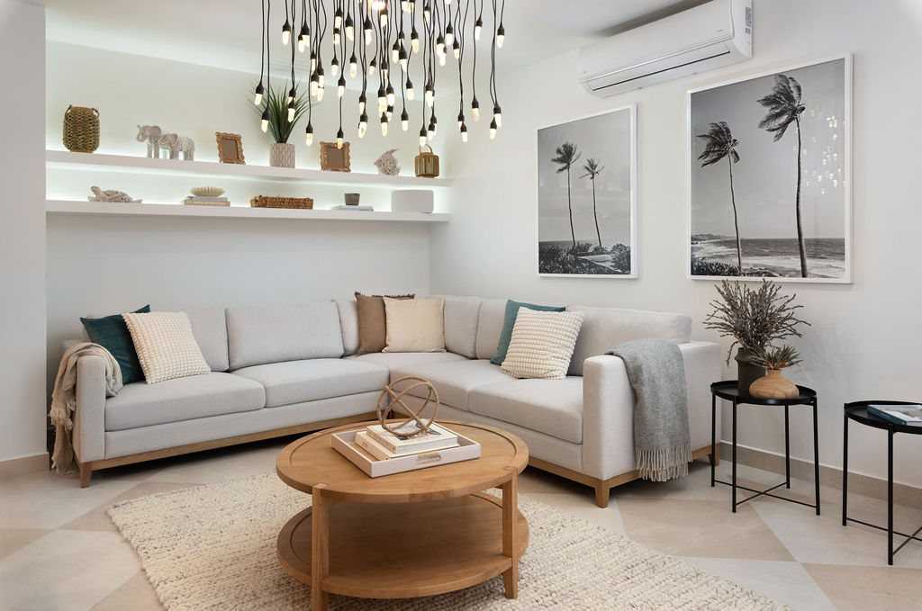 Living room with sofas and coastal decor at Calico, a beachfront villa in St James, Barbados