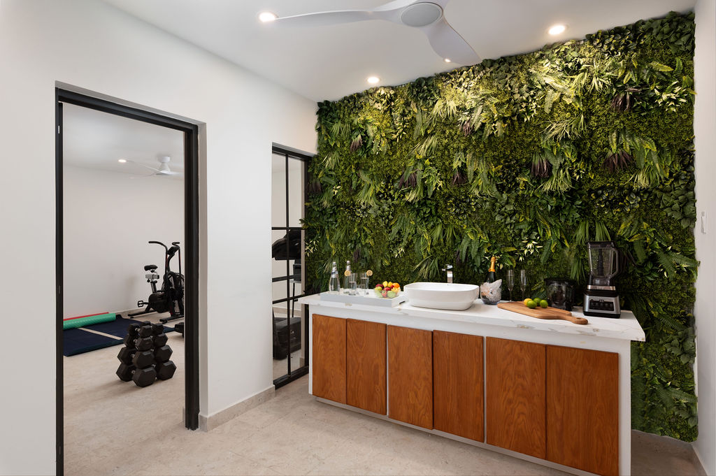 Outdoor shower with tropical greenery at Calico, a beachfront villa in St James, Barbados