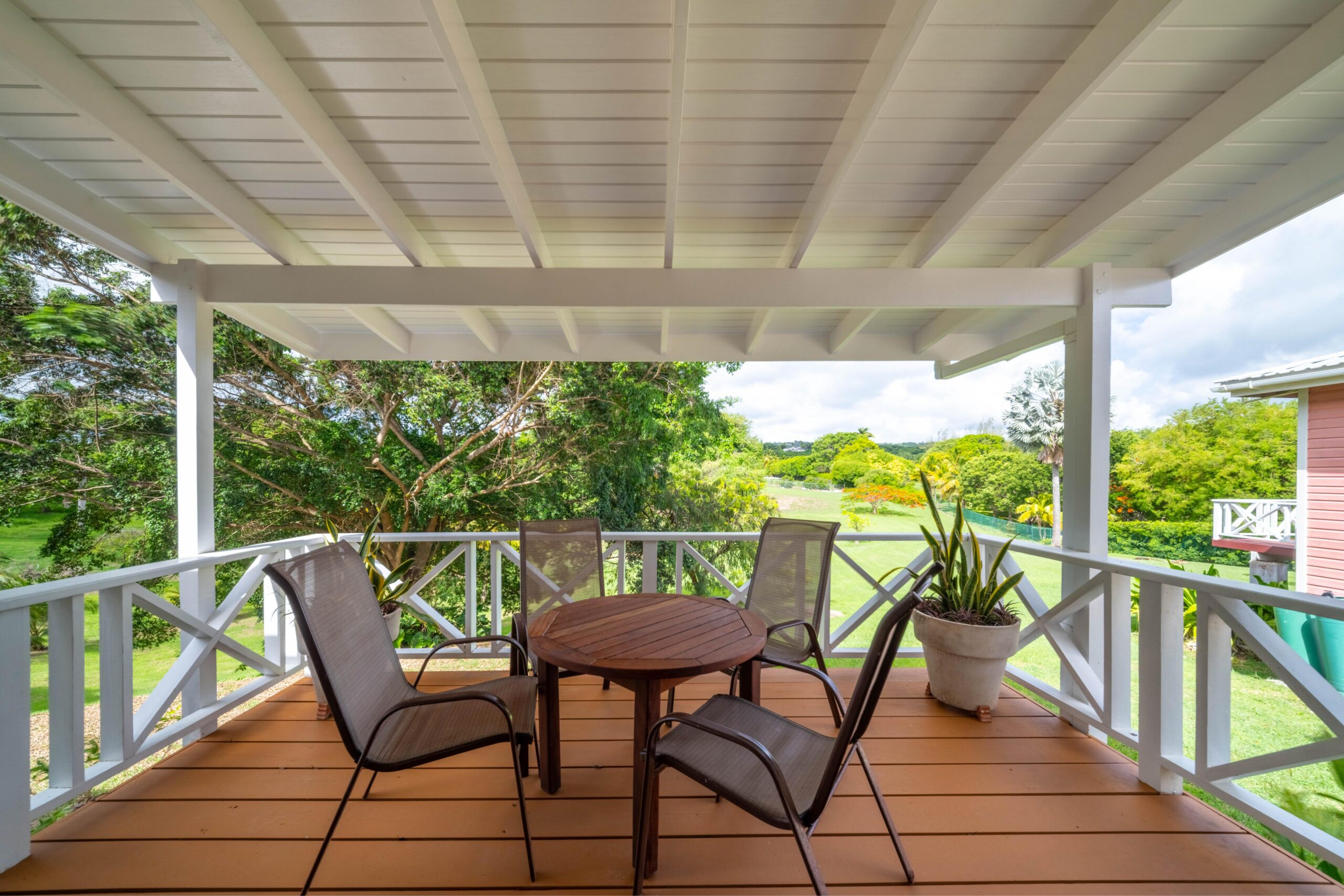 Covered veranda with dining and garden views at 39 Blowers, St James