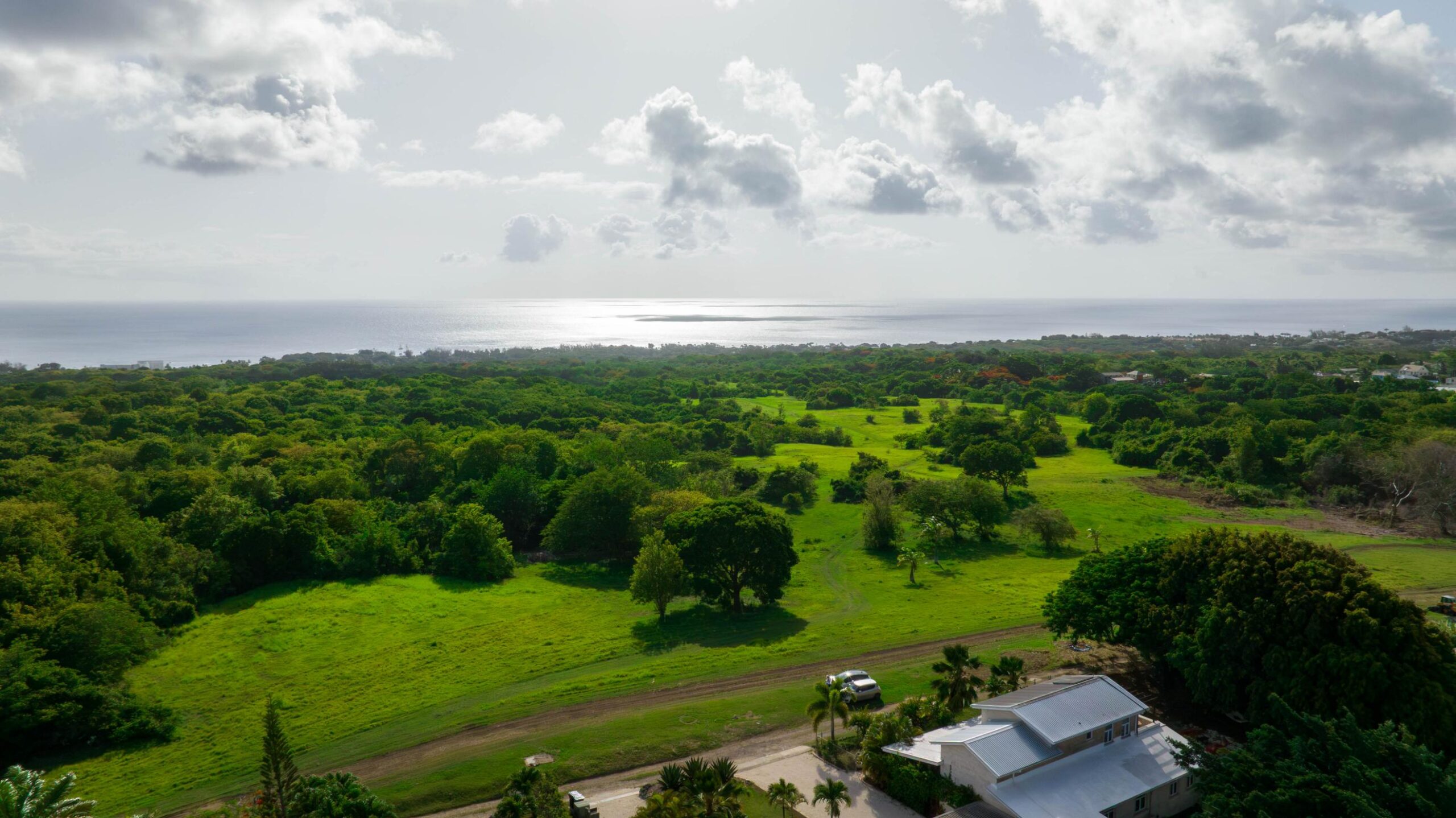 Aerial view of the countryside and West Coast sea from 39 Blowers, St James