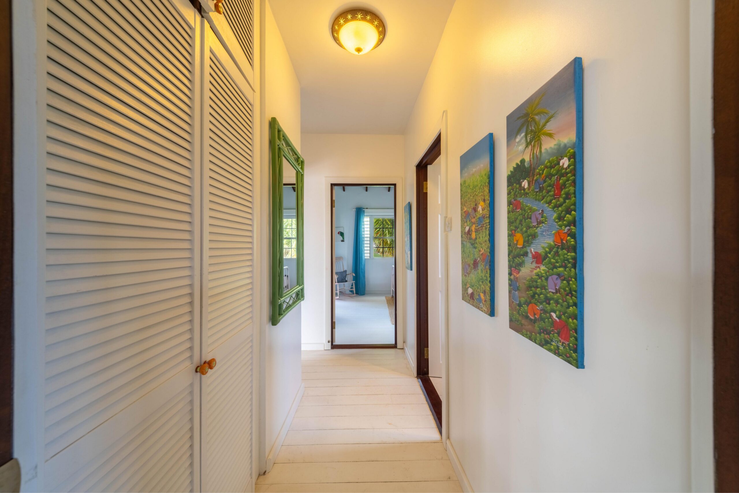 Hallway with louvered doors in the guest cottage at 39 Blowers, St James