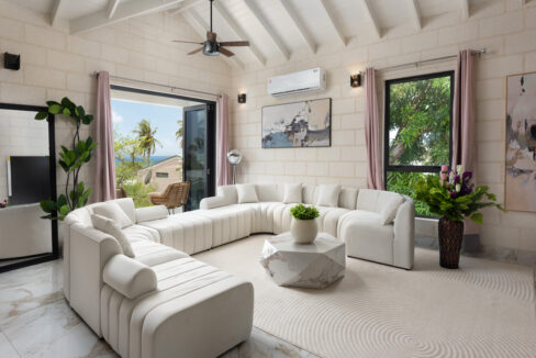 Sitting room opening to a sea-view terrace at Hill Station, Prospect, St James