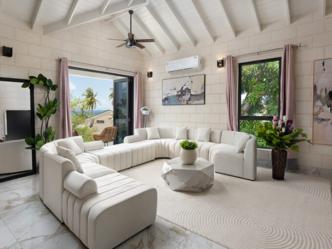 Sitting room opening to a sea-view terrace at Hill Station, Prospect, St James