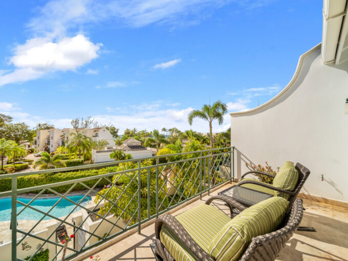 Upstairs patio with garden and sea views at Jus Chillin, Mullins Bay, St Peter