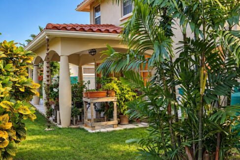 Front exterior with landscaped gardens at Morningstar, The Palms, St George
