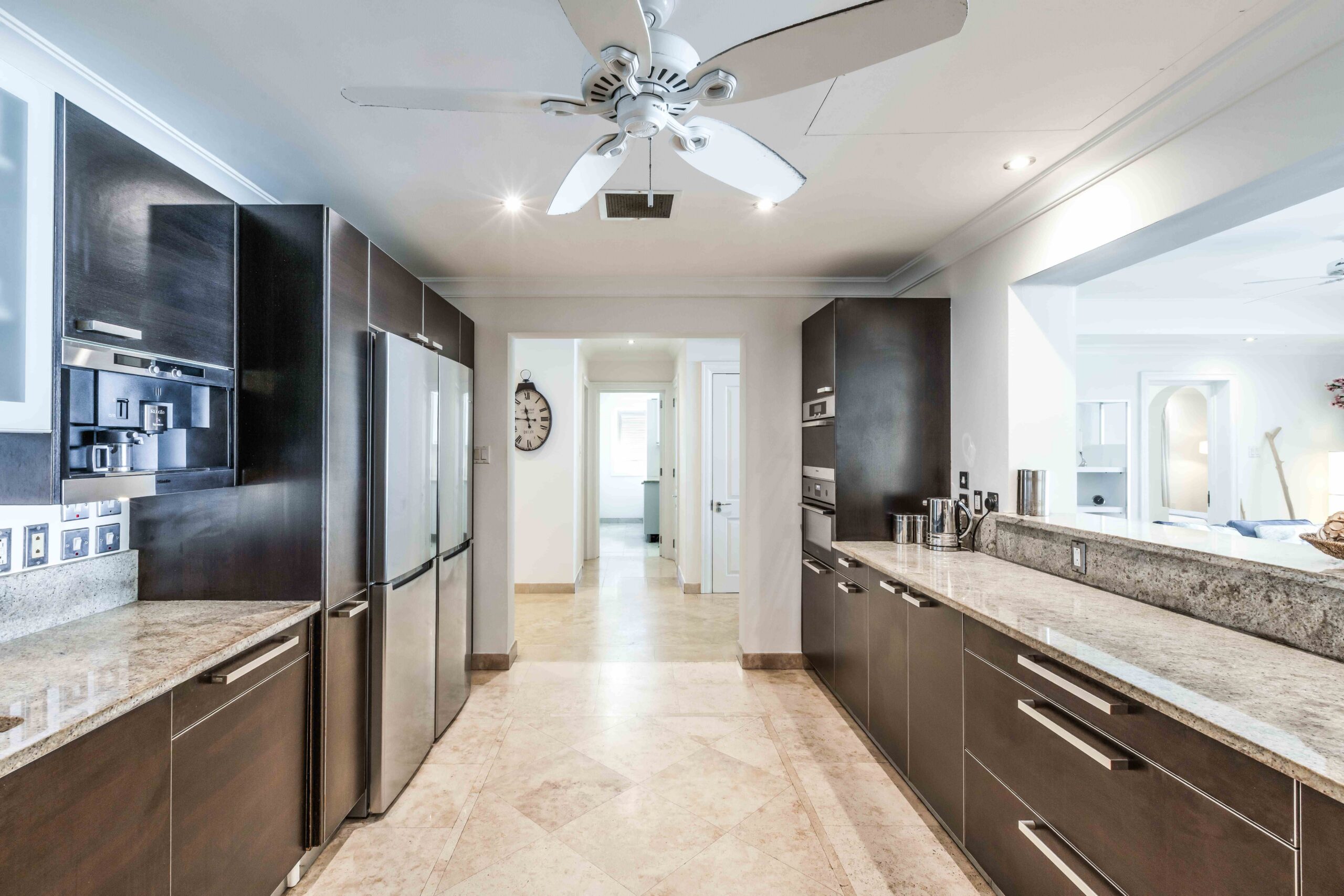 Kitchen with island and stainless steel appliances at Sandy Cove 201, St James
