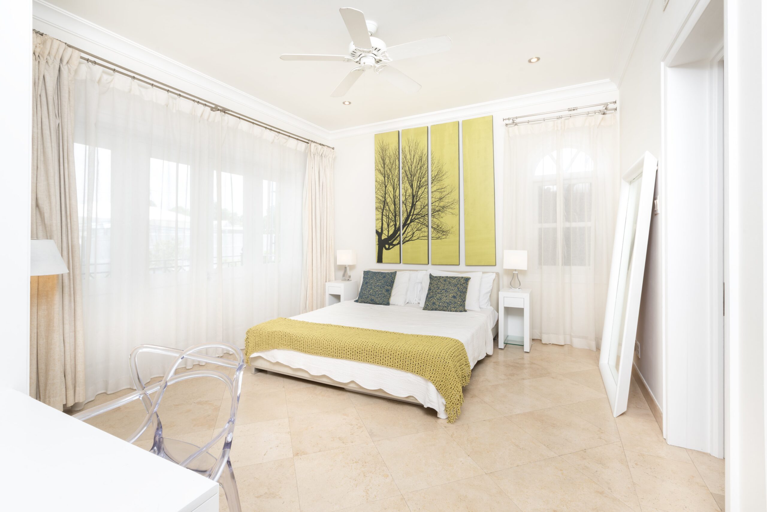 Bedroom with yellow accents at Sandy Cove 201, St James