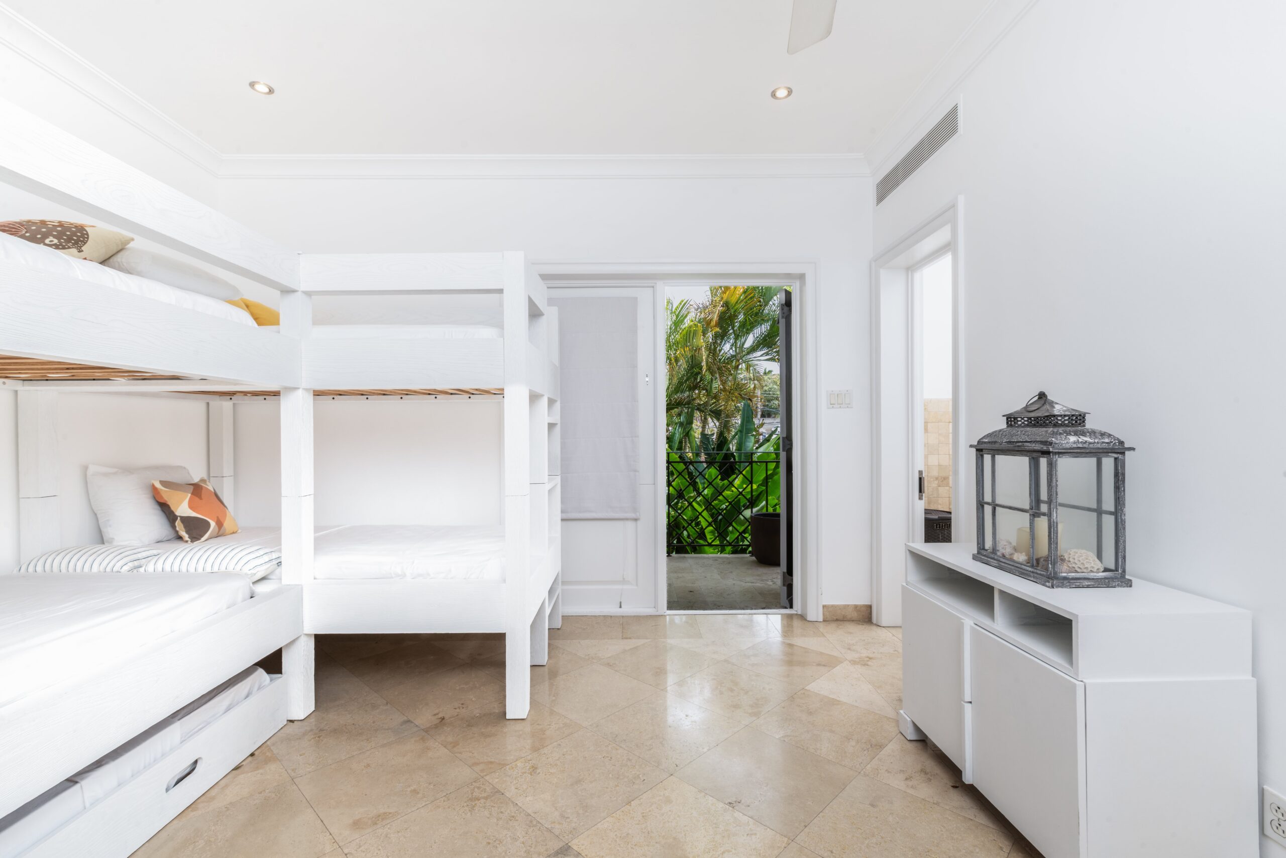 Bunk bedroom with garden access at Sandy Cove 201, St James