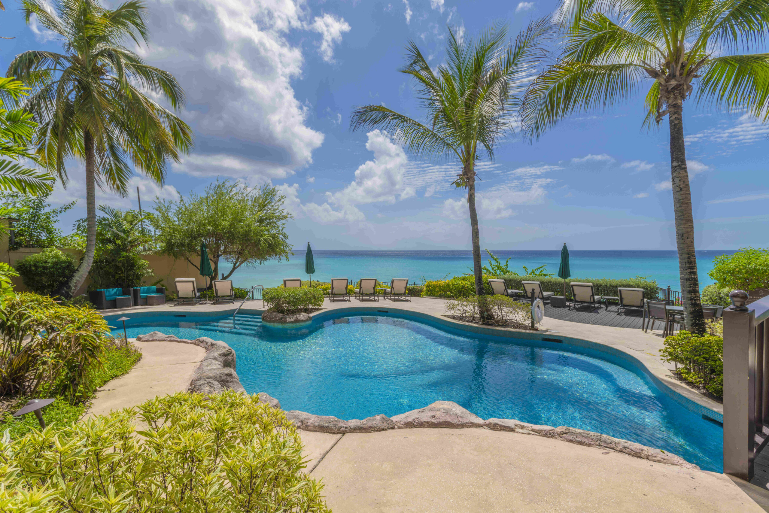 Communal swimming pool with sea views at Sandy Cove 201, St James