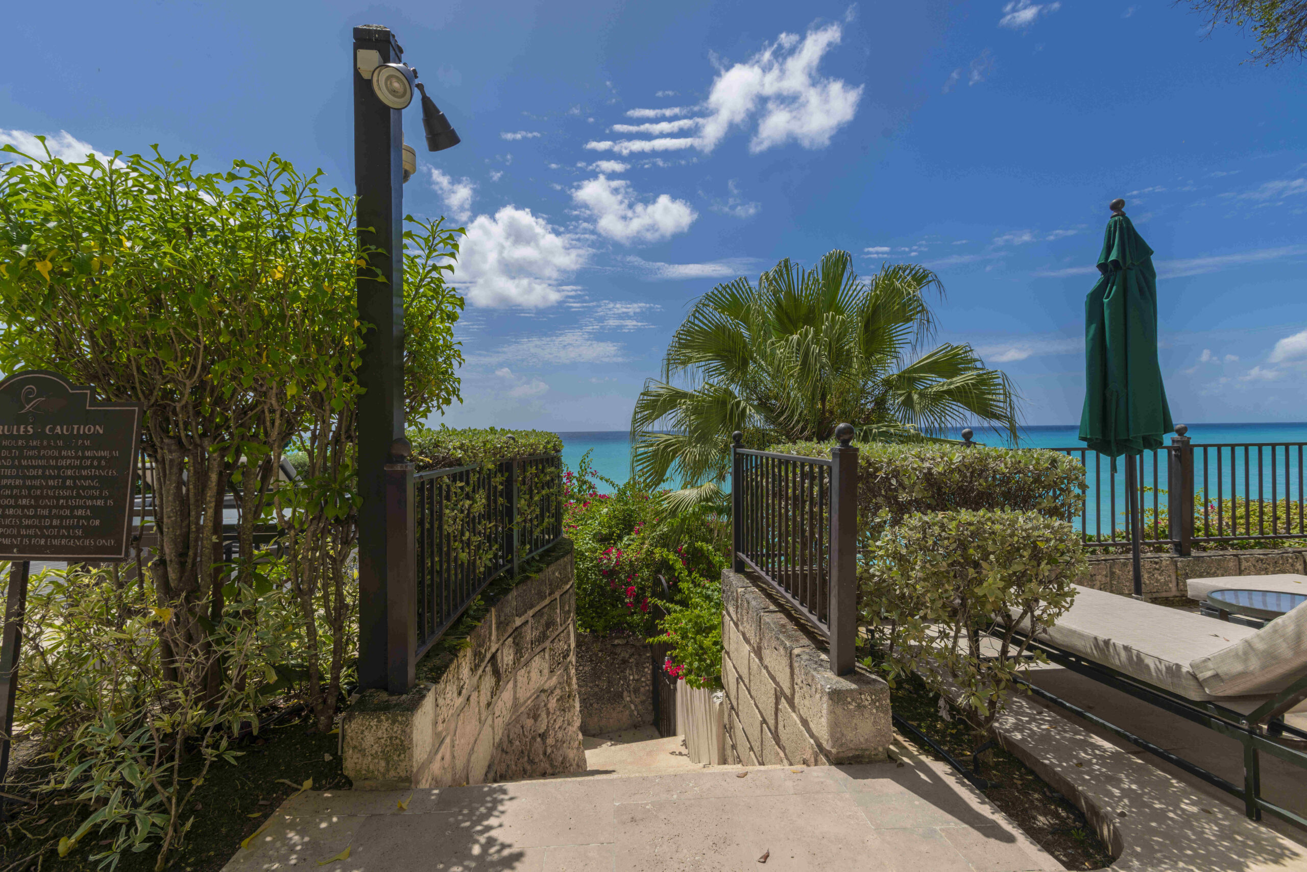 Sea-view terrace with steps down to the beach at Sandy Cove 201, St James