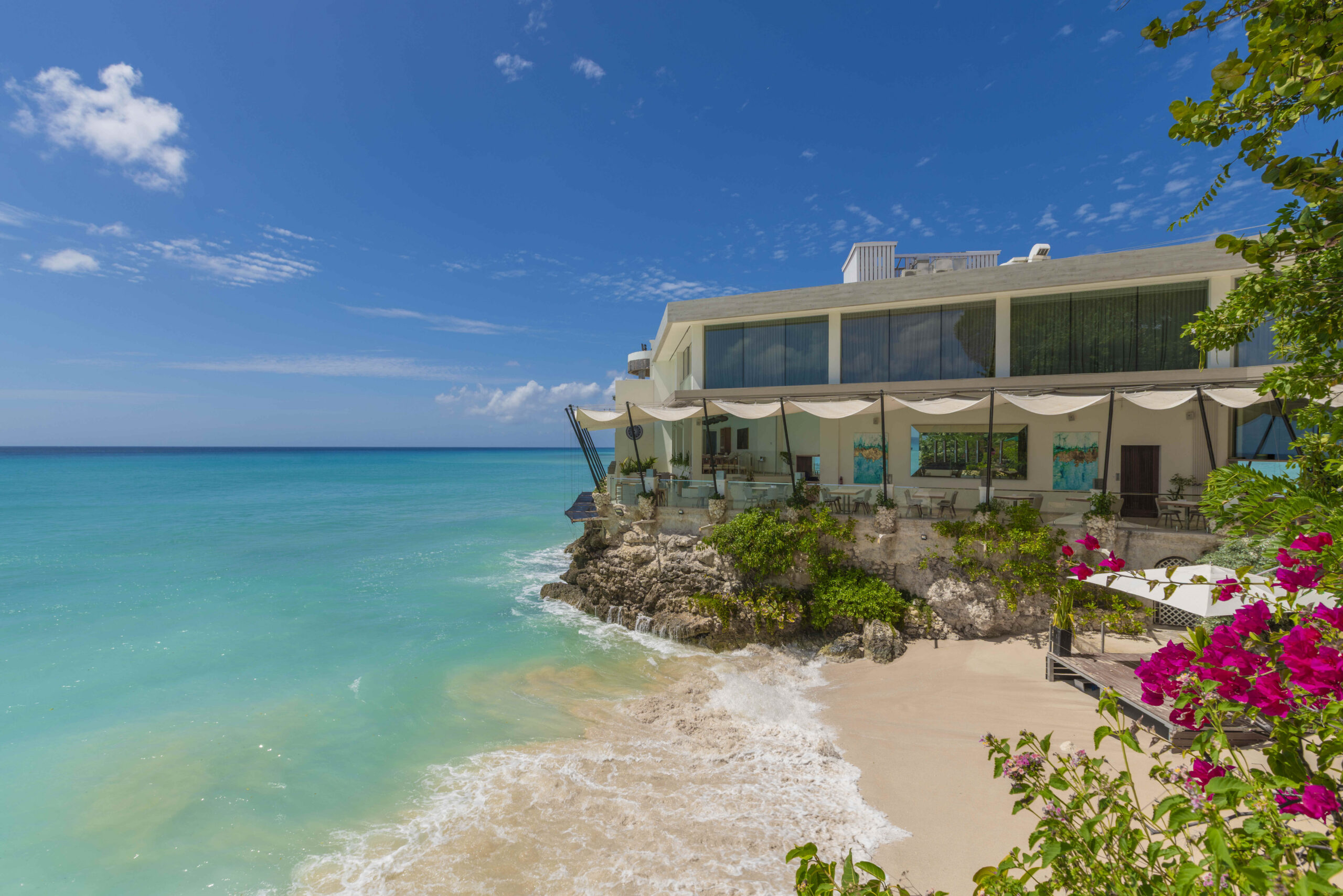 Beachfront exterior of Sandy Cove 201, a corner apartment for sale on the west coast, St James, Barbados