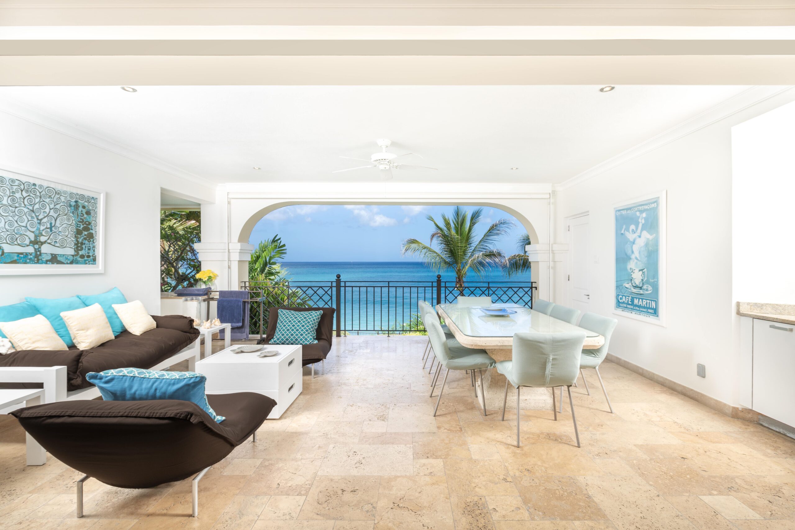 Living room opening to the sea-view terrace at Sandy Cove 201, St James
