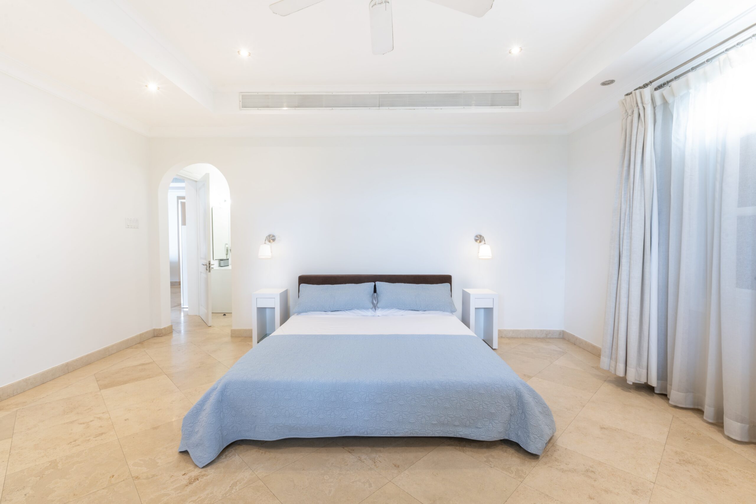 Bedroom with sea-facing windows at Sandy Cove 201, St James