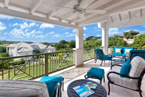 Covered terrace with seating and resort views at Sugar Cane Ridge 12, Royal Westmoreland, St James