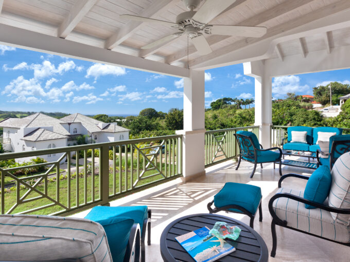 Covered terrace with seating and resort views at Sugar Cane Ridge 12, Royal Westmoreland, St James