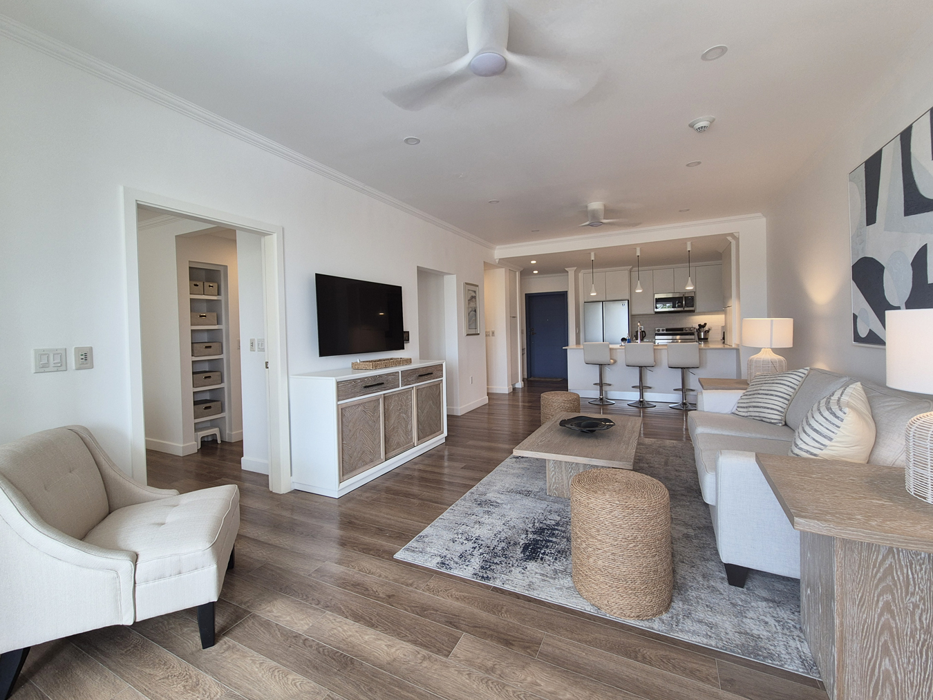Living room with a wall-mounted TV at The Estates at St. George M102, St George