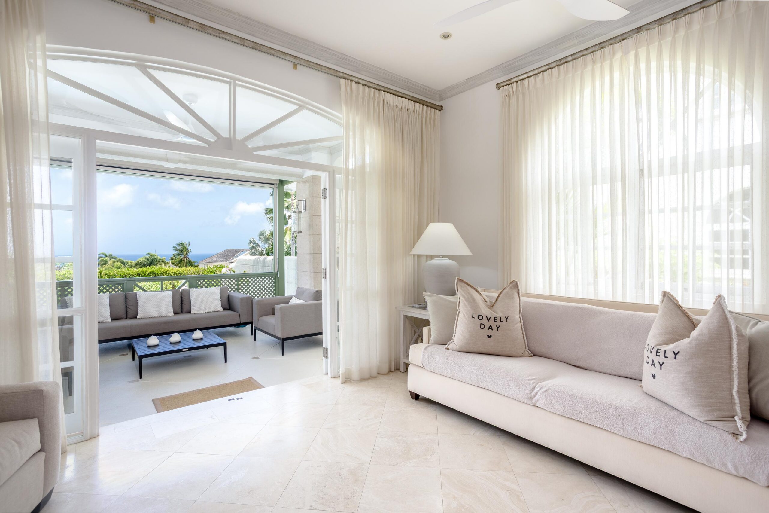 Bright living area with Caribbean sea views at Escape 2 Tamarind Row, Sugar Hill