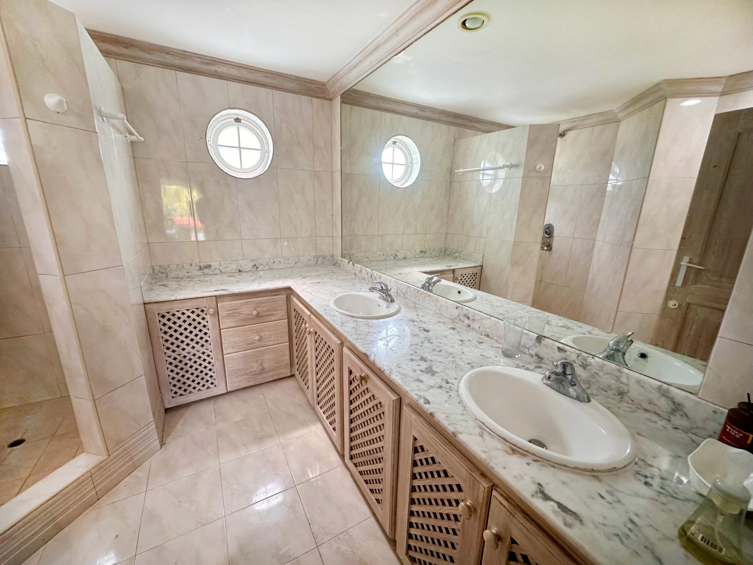En-suite bathroom with marble vanity and tub at Forest Hills 6, St. James