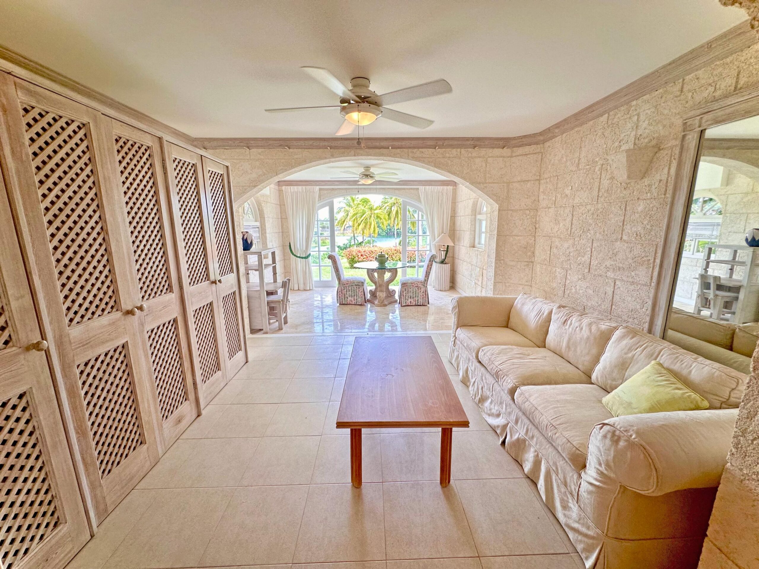 Lounge with sectional sofa opening to the garden at Forest Hills 6, St. James