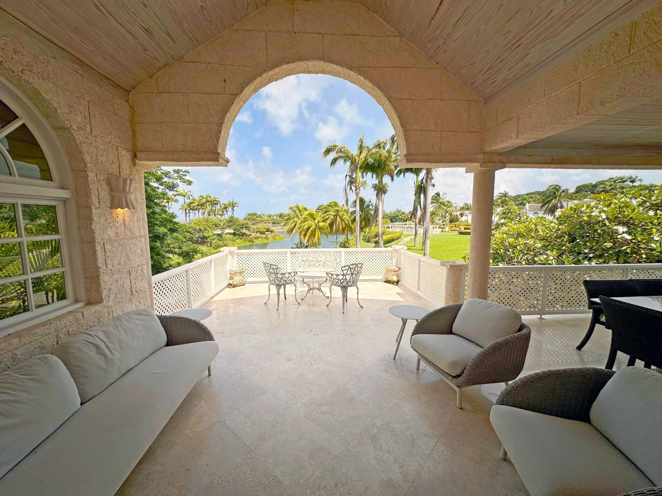 Covered terrace with seating and garden views at Forest Hills 6, St. James