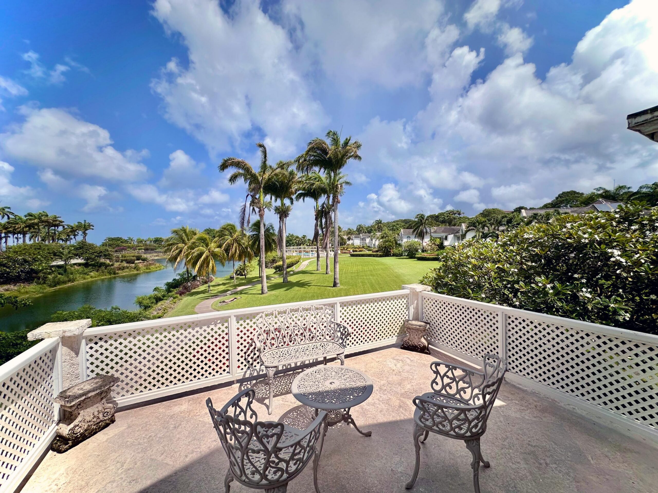Covered terrace overlooking the lake and gardens at Forest Hills 6, Royal Westmoreland