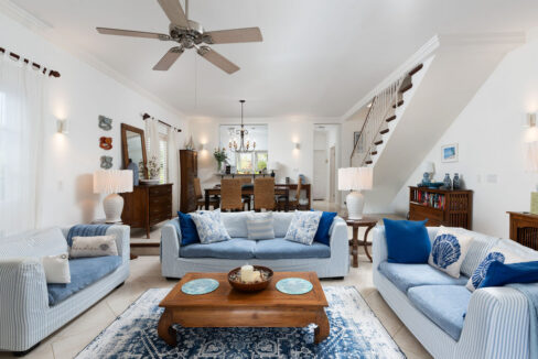 Open-plan living and dining area with staircase at Turtle View 10, Porters